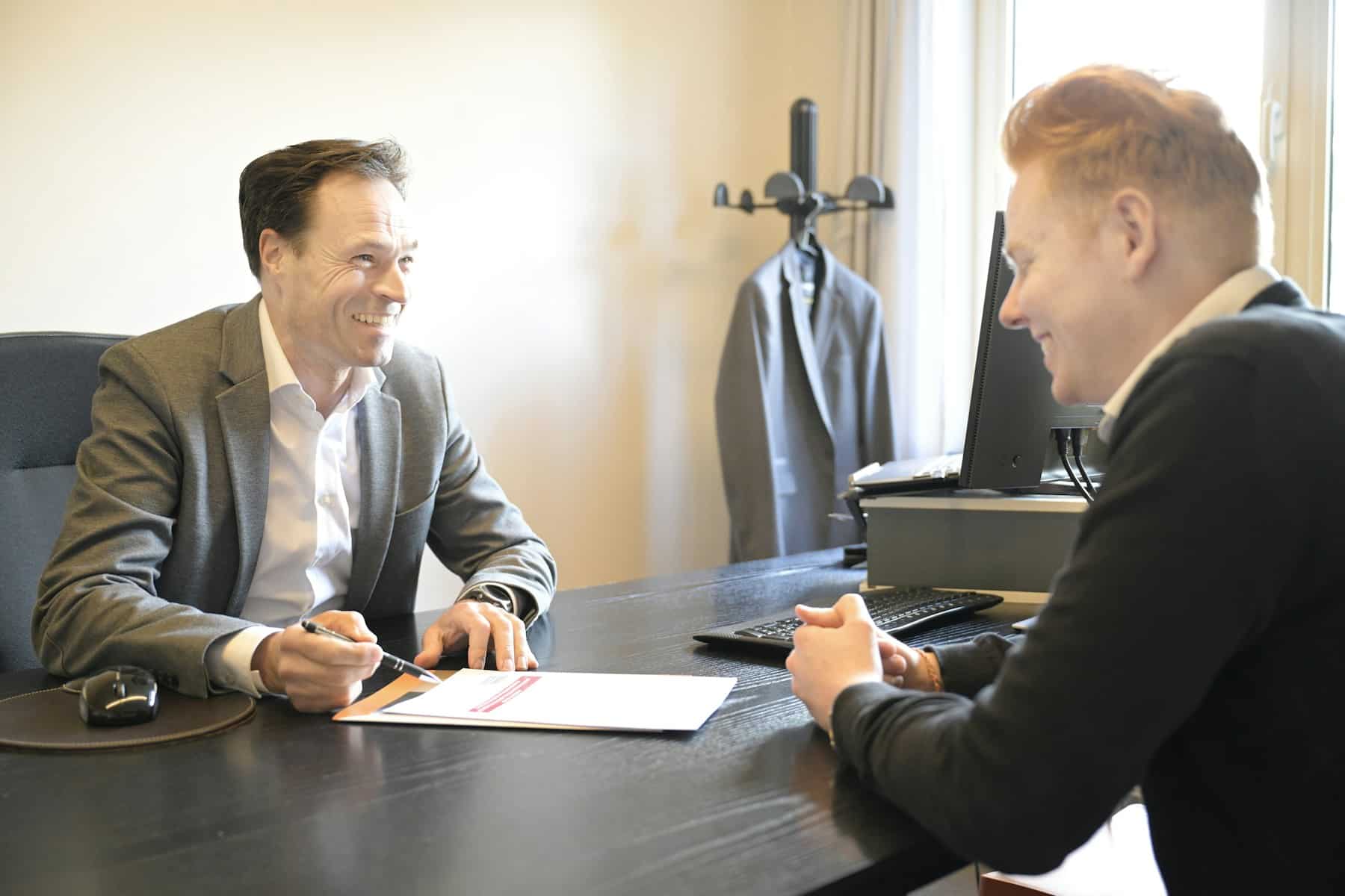 Small Business Loans | Funding for Your Business 6 Funding specialist reviewing documents with a business owner